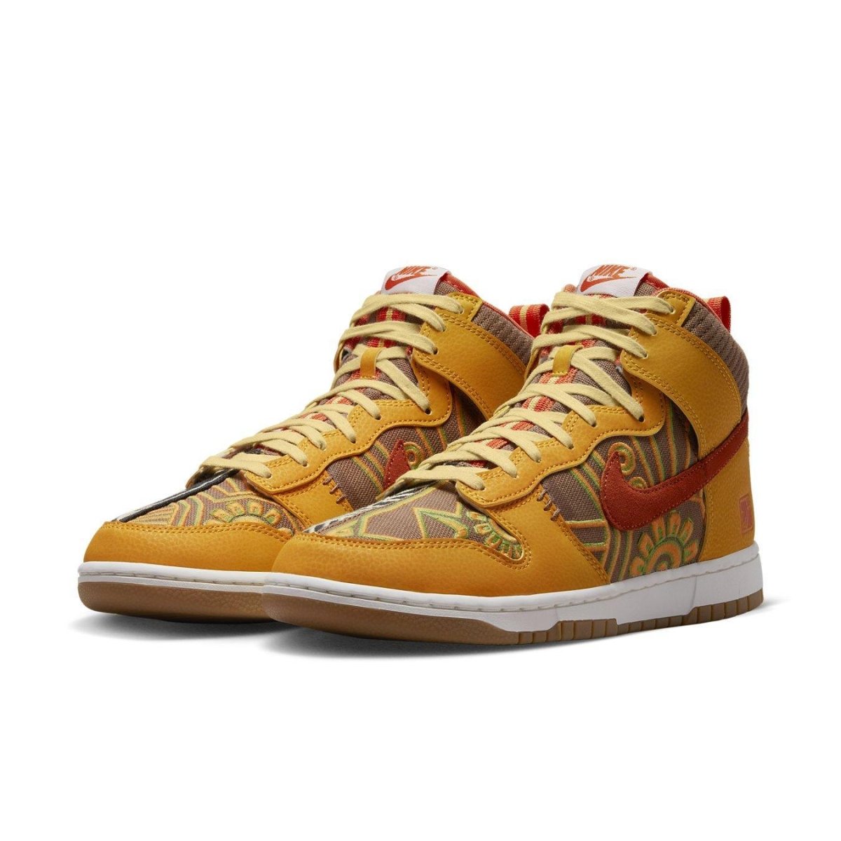 Nike Dunk High PRM "Somos Familia" with gold leather and colorful textile design celebrating Día de Muertos.