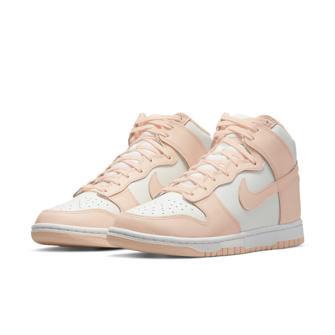 Nike Dunk High Sail Crimson Tint (W) sneakers in soft pink and white, blending elegance with sporty style for women.