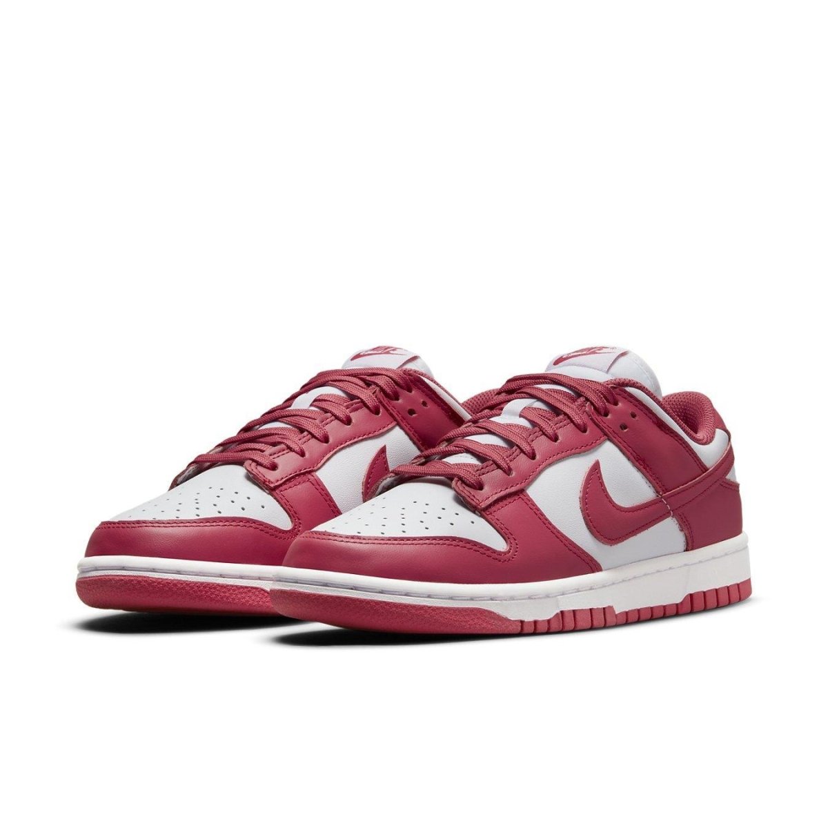 Nike Dunk Low Archeo Pink (W) sneakers featuring white leather base and pink accents, perfect for stylish comfort.