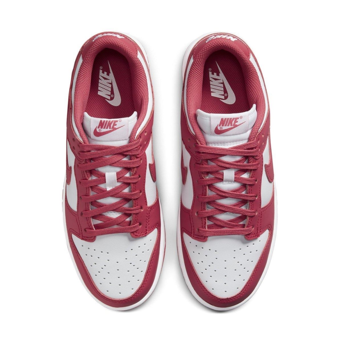 Nike Dunk Low Archeo Pink Women's sneakers with white leather and pink accents, showcasing a stylish top view.