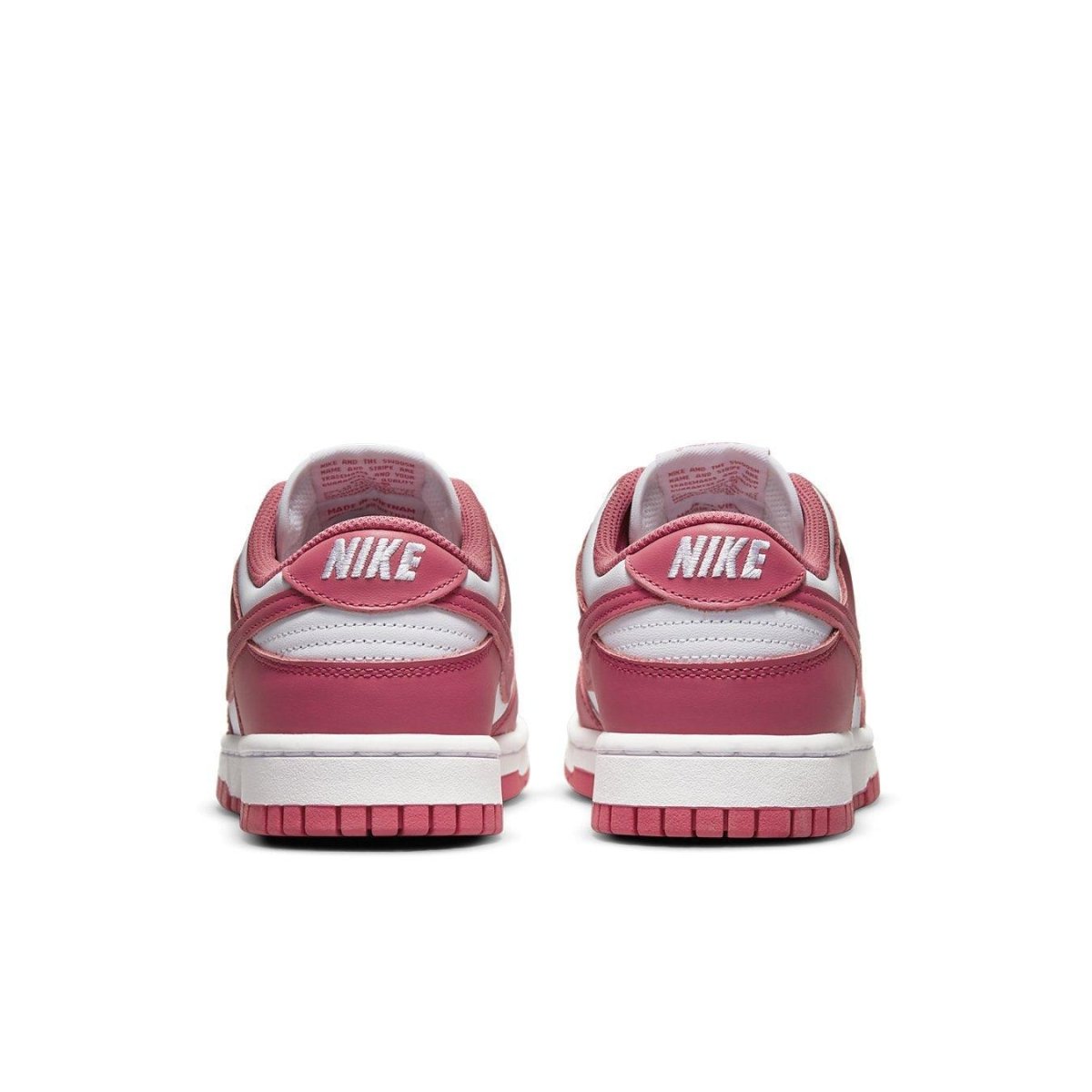 Nike Dunk Low Archeo Pink women's sneakers, featuring a white and pink leather design with contrasting laces.