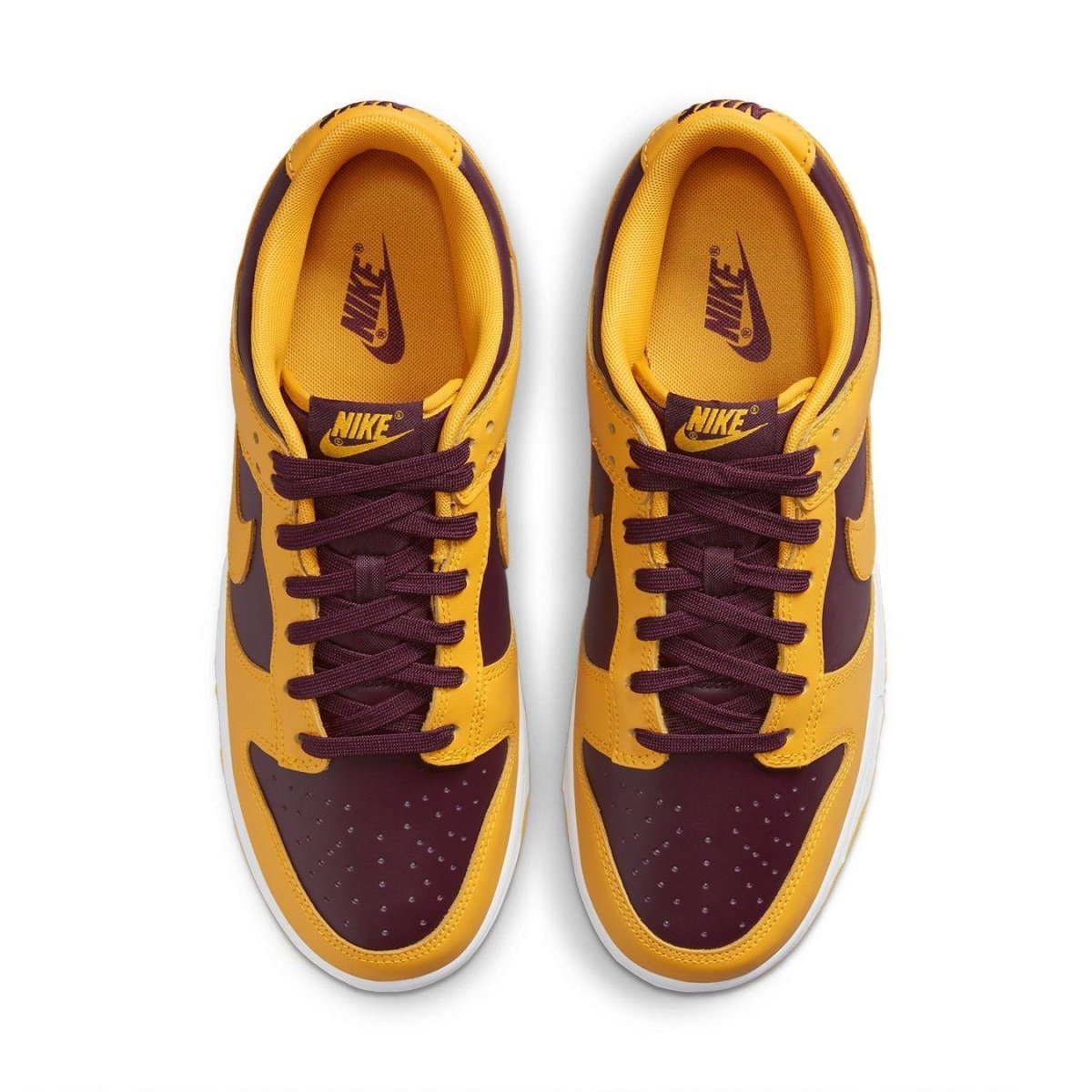 Nike Dunk Low Arizona State sneaker in yellow and burgundy colorway, featuring laces and iconic Nike branding.