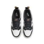 Nike Dunk Low Black White Metallic (GS) sneakers with black and white leather upper and metallic accents.