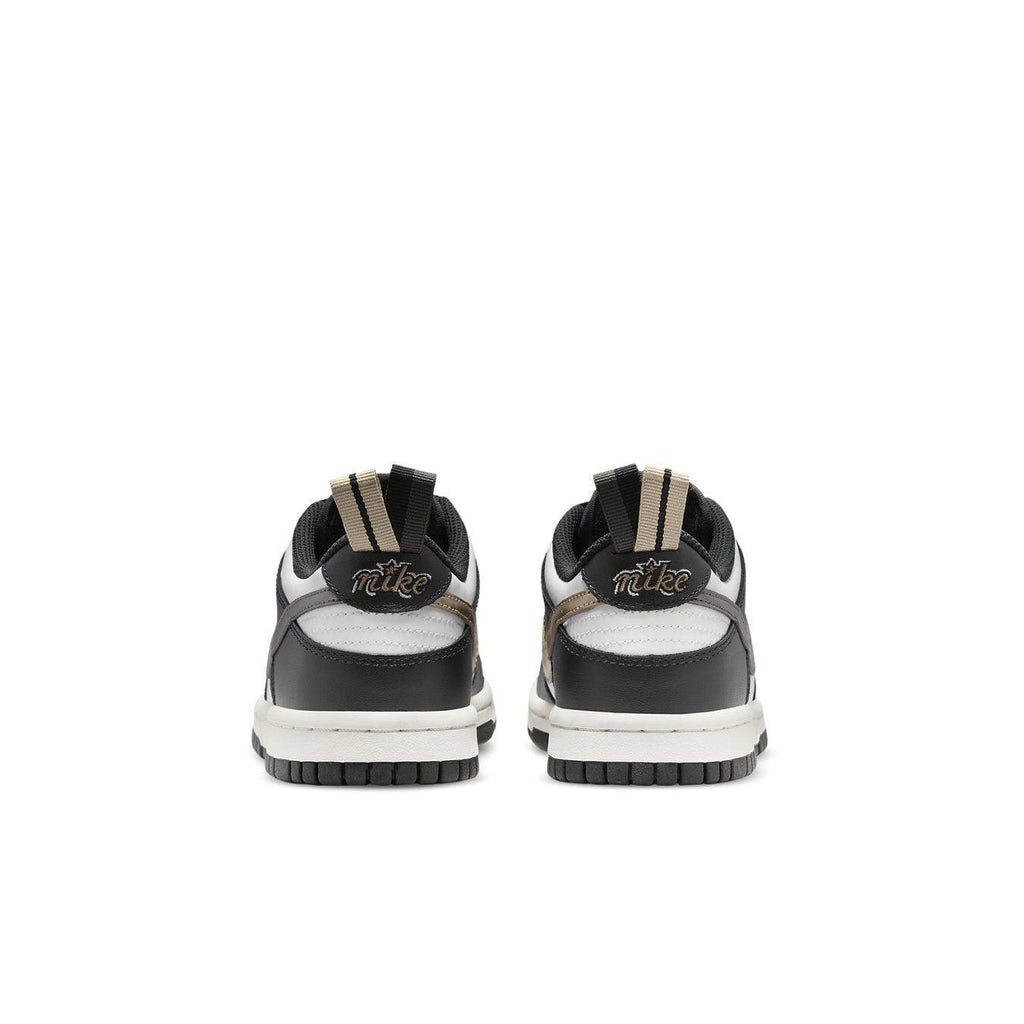 Nike Dunk Low Black White Metallic (GS) rear view showing black and white colorway with metallic details.