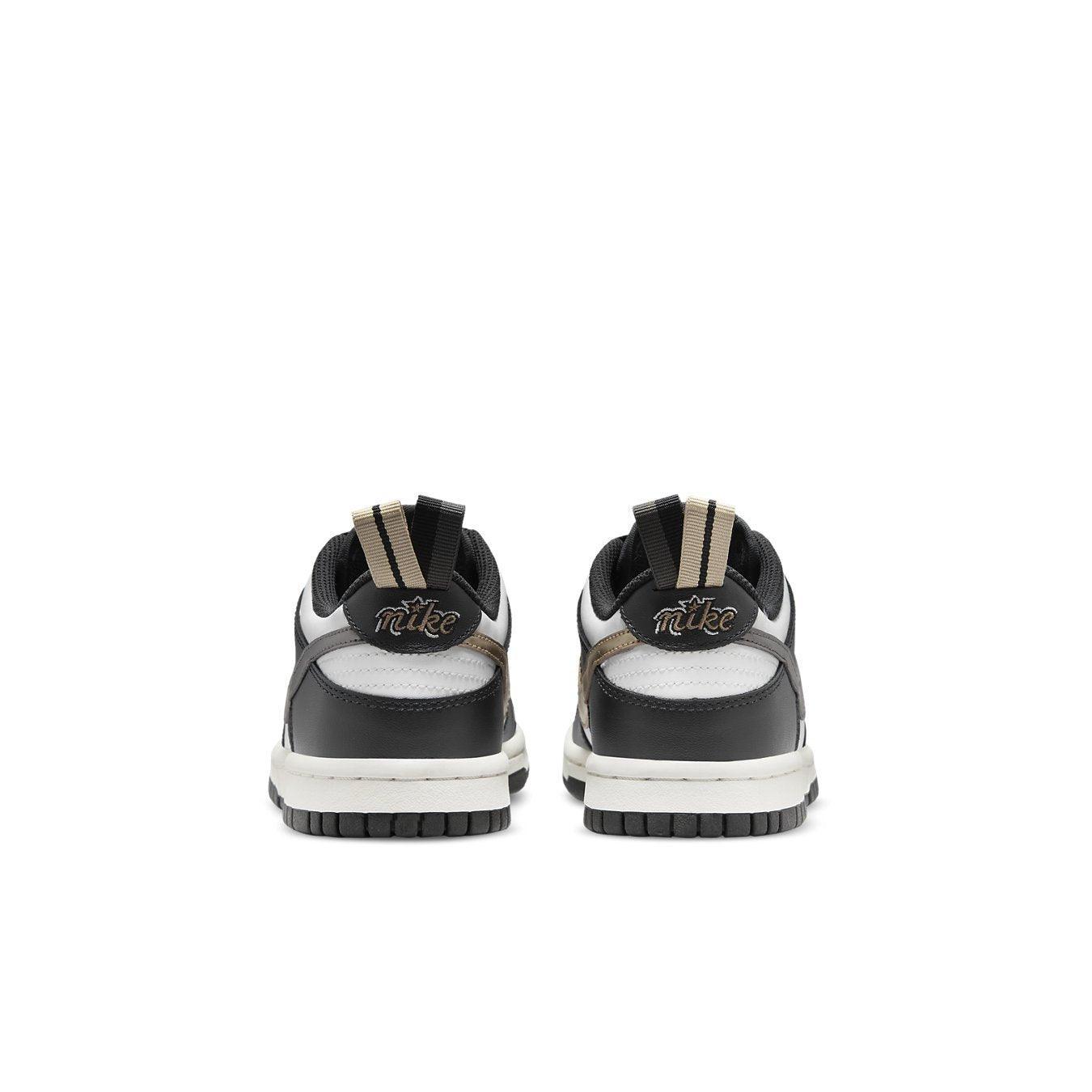 Nike Dunk Low Black White Metallic (GS) rear view showing black and white colorway with metallic details.