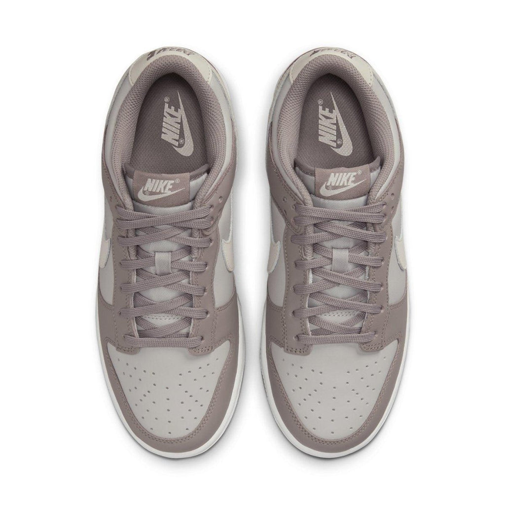 Nike Dunk Low Bone Beige (W) sneakers top view showcasing minimalist design and soft color palette.