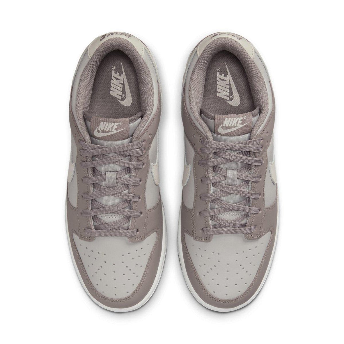 Nike Dunk Low Bone Beige (W) sneakers top view showcasing minimalist design and soft color palette.