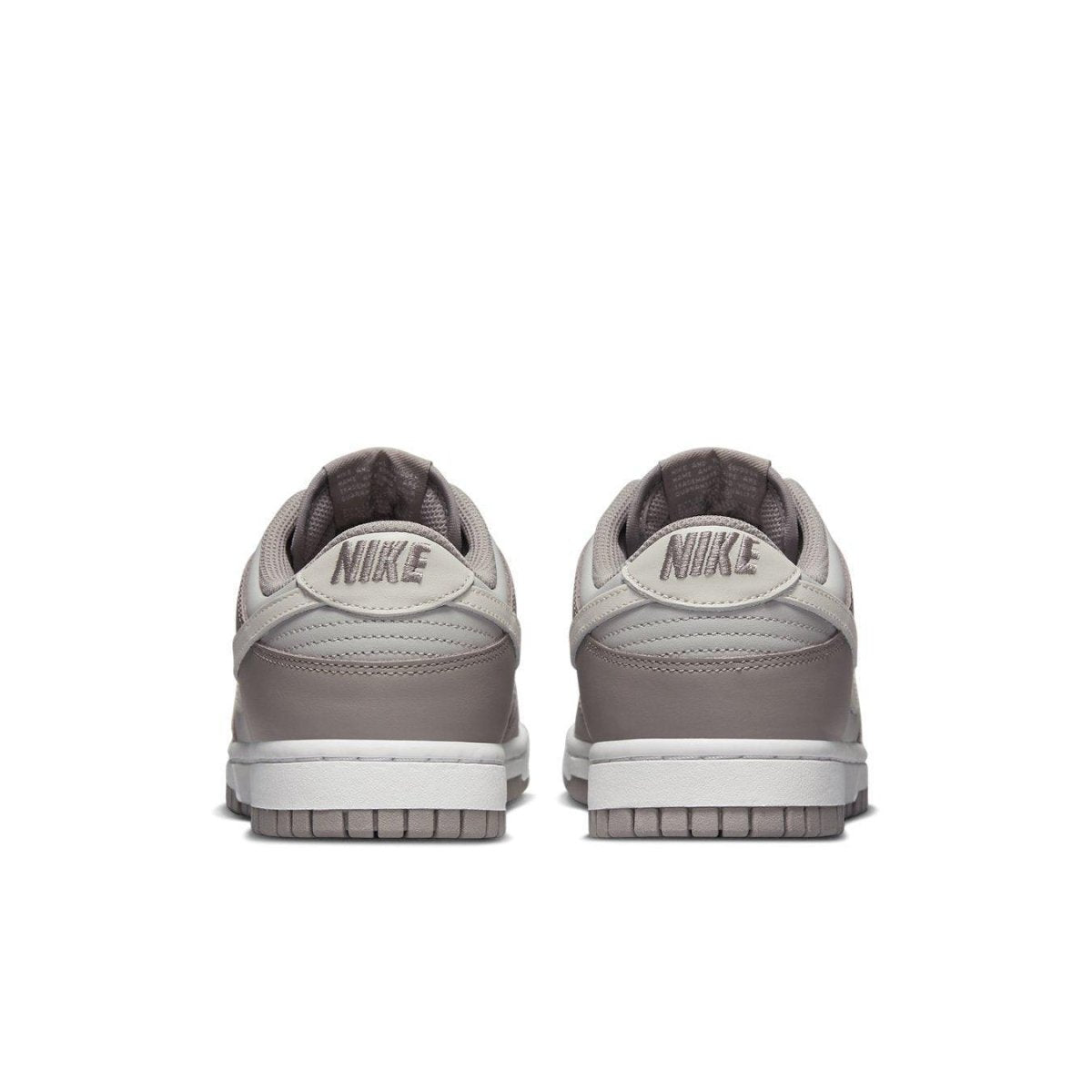 Nike Dunk Low Bone Beige (W) rear view showcasing minimalistic design and soft color palette.