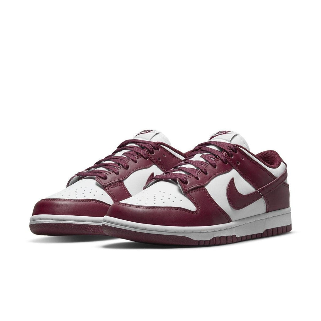 Nike Dunk Low Bordeaux women's sneakers featuring a maroon and white colorway with Swoosh logo.