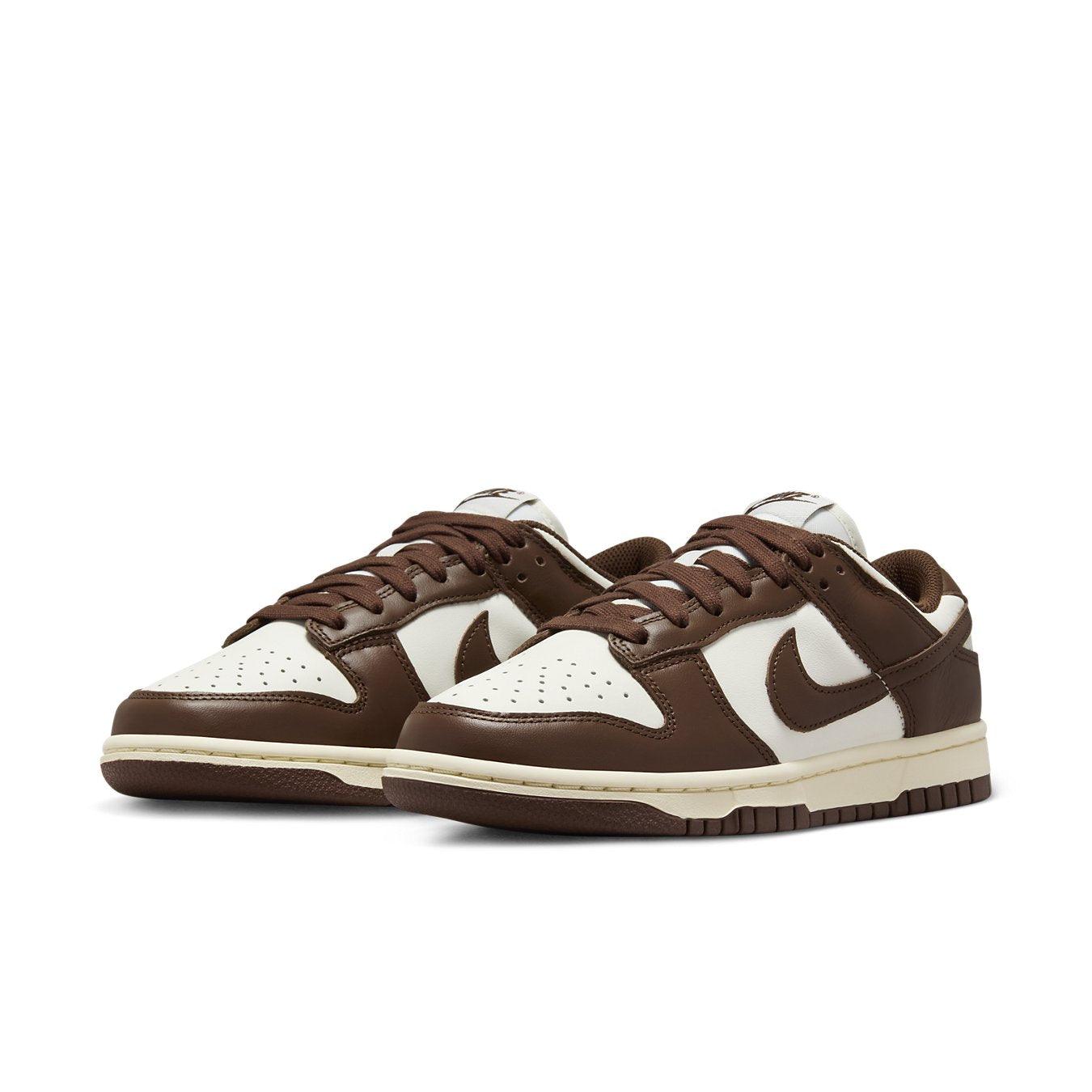 Nike Dunk Low Cacao Wow women's sneakers featuring brown overlays and white leather upper.