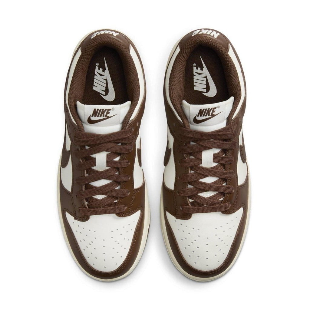 Nike Dunk Low Cacao Wow women's sneakers in white and chocolate brown with classic Nike branding.