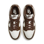 Nike Dunk Low Cacao Wow women's sneakers in white and chocolate brown with classic Nike branding.