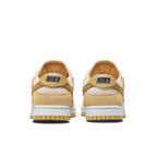 Nike Dunk Low Celestial Gold Suede women's sneakers, featuring a golden suede upper and textured back detail.