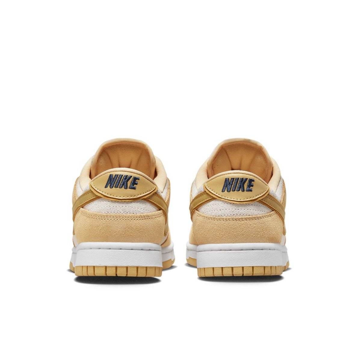 Nike Dunk Low Celestial Gold Suede women's sneakers, featuring a golden suede upper and textured back detail.