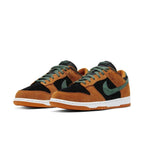 Nike Dunk Low Ceramic (2020) in black, green, and ceramic suede with white sole, showcasing a stylish design.