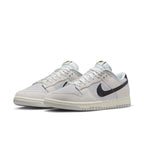 Nike Dunk Low Certified Fresh sneakers featuring grey mesh and suede, black swoosh, and retro basketball design.