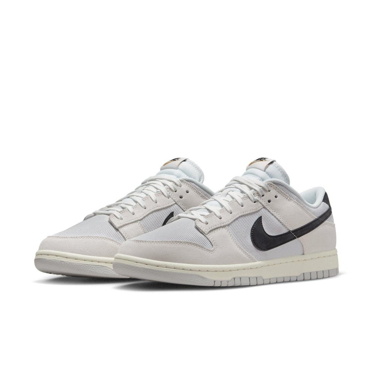 Nike Dunk Low Certified Fresh sneakers featuring grey mesh and suede, black swoosh, and retro basketball design.