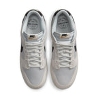 Nike Dunk Low Certified Fresh sneaker in white mesh and beige suede with black Swoosh, top view.