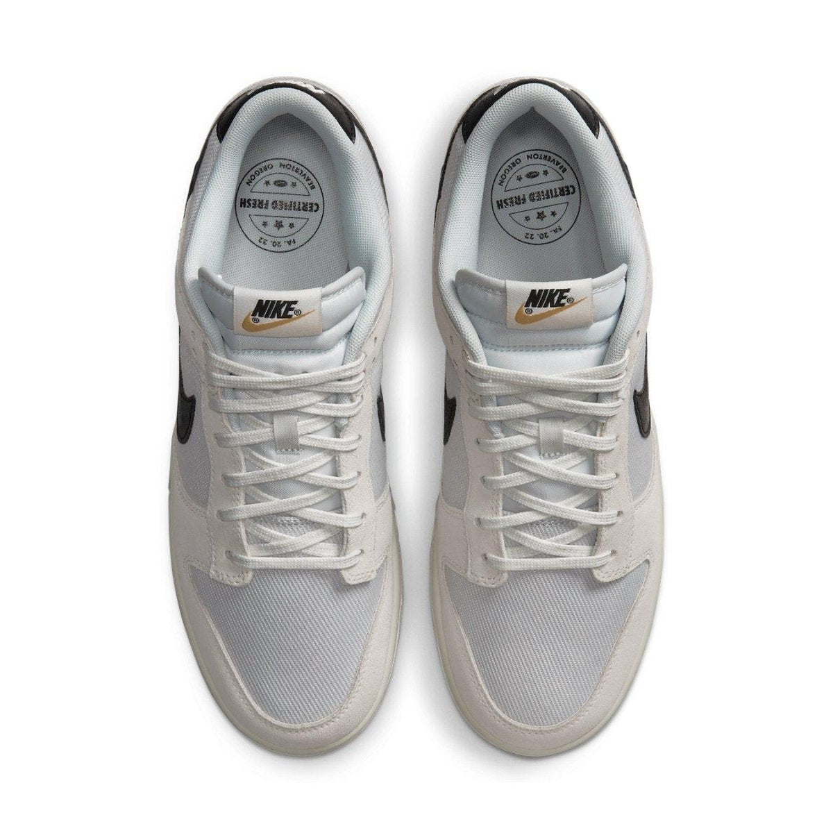 Nike Dunk Low Certified Fresh sneaker in white mesh and beige suede with black Swoosh, top view.