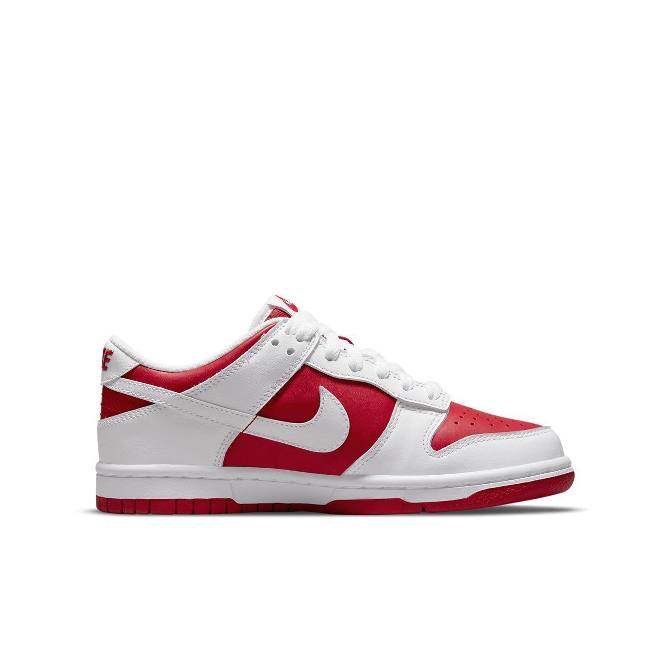 Nike Dunk Low Championship Red (2021) GS in white and red, featuring a sleek sneaker design.