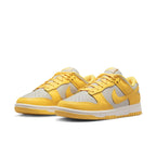 Nike Dunk Low Citron Pulse women's sneakers with yellow and grey leather upper and classic lace closure.