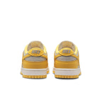 Nike Dunk Low Citron Pulse (W) shoes in yellow with leather upper and perforated toe for ventilation.