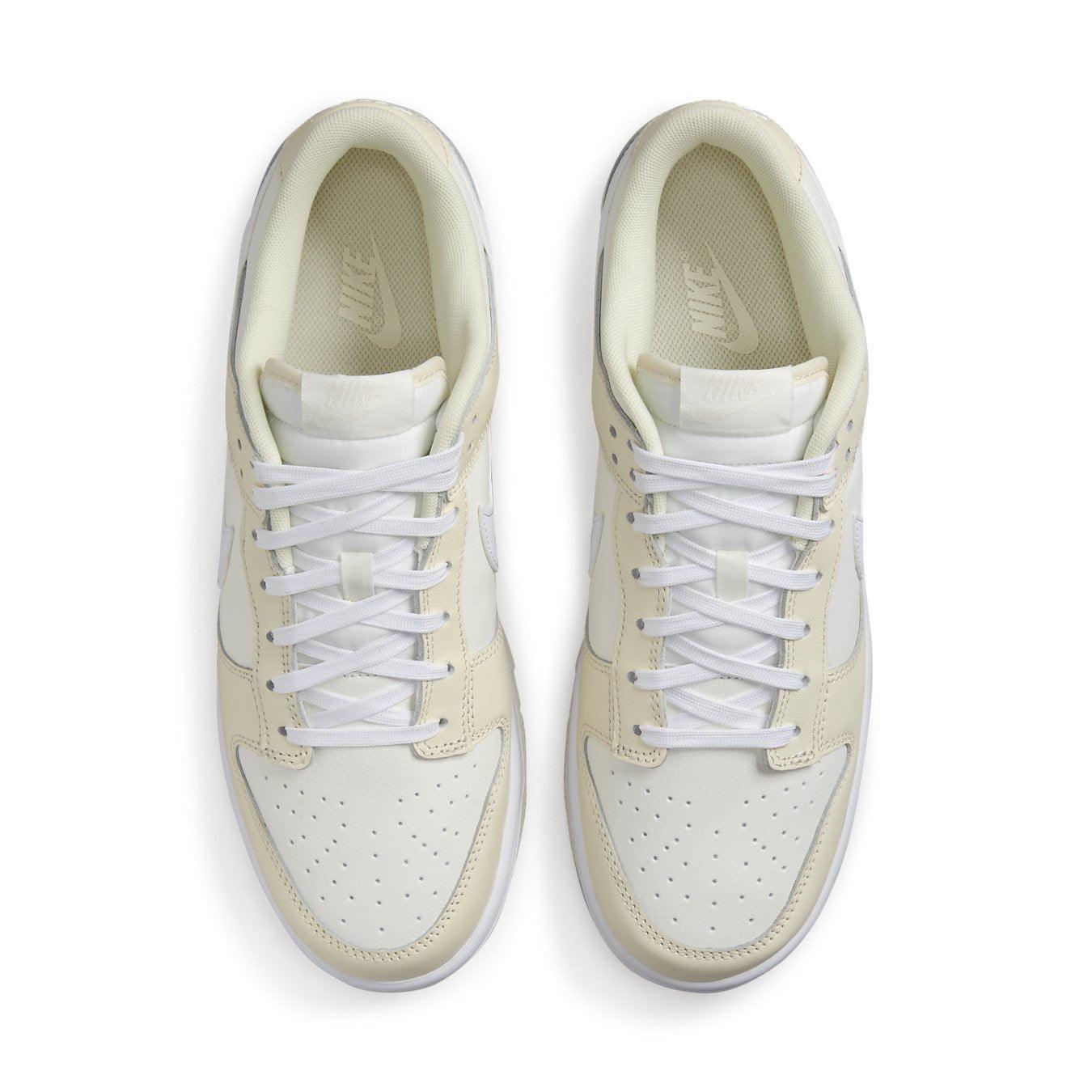 Nike Dunk Low Coconut Milk shoes featuring smooth cream leather and classic Swoosh design.