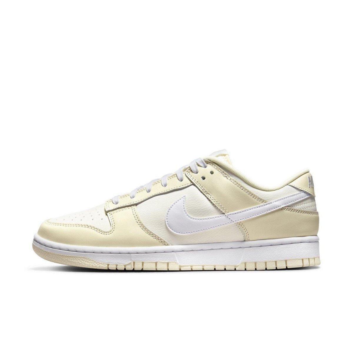 Nike Dunk Low Coconut Milk in cream and coconut milk tones, featuring smooth and perforated leather.