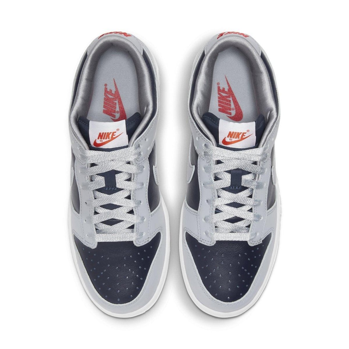 Nike Dunk Low College Navy Grey (W) top view showing navy and grey colorway with perforated toe and branded details.