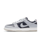 Nike Dunk Low College Navy Grey sneaker side view with bold colorblocking and sleek design.