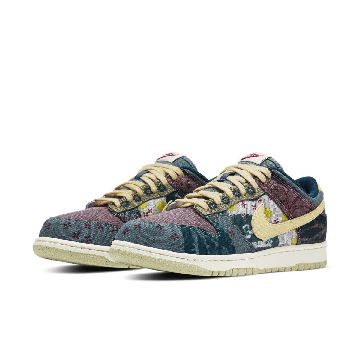 Nike Dunk Low Community Garden sneakers featuring a colorful patchwork design in earthy tones.