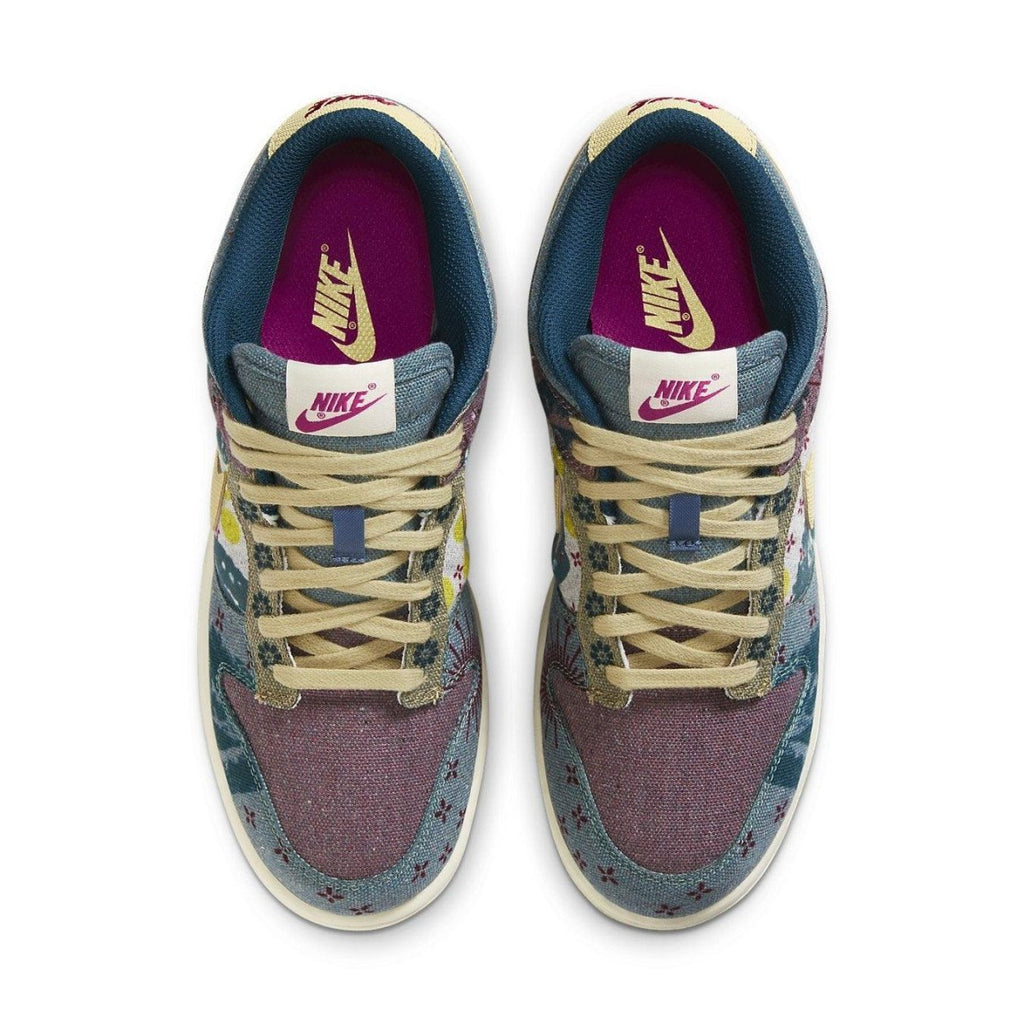 Nike Dunk Low Community Garden sneakers featuring a collage design with earth tones and floral patterns.