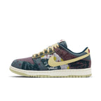 Nike Dunk Low Community Garden sneaker featuring earth tones and patchwork design in a low-top style.