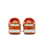 Nike Dunk Low Cracked Orange women's sneakers, showcasing the back view with vibrant Total Orange accents.