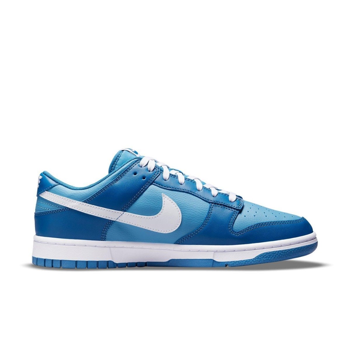 Nike Dunk Low in Dark Marina Blue with white accents and Air Jordan-inspired sole design.