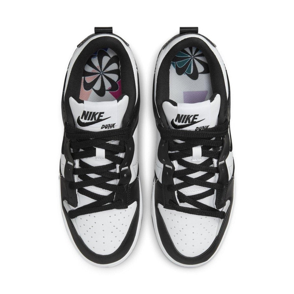Nike Dunk Low Disrupt 2 Panda women's sneakers, featuring black and white design with a perforated toe and contrasting Swoosh.