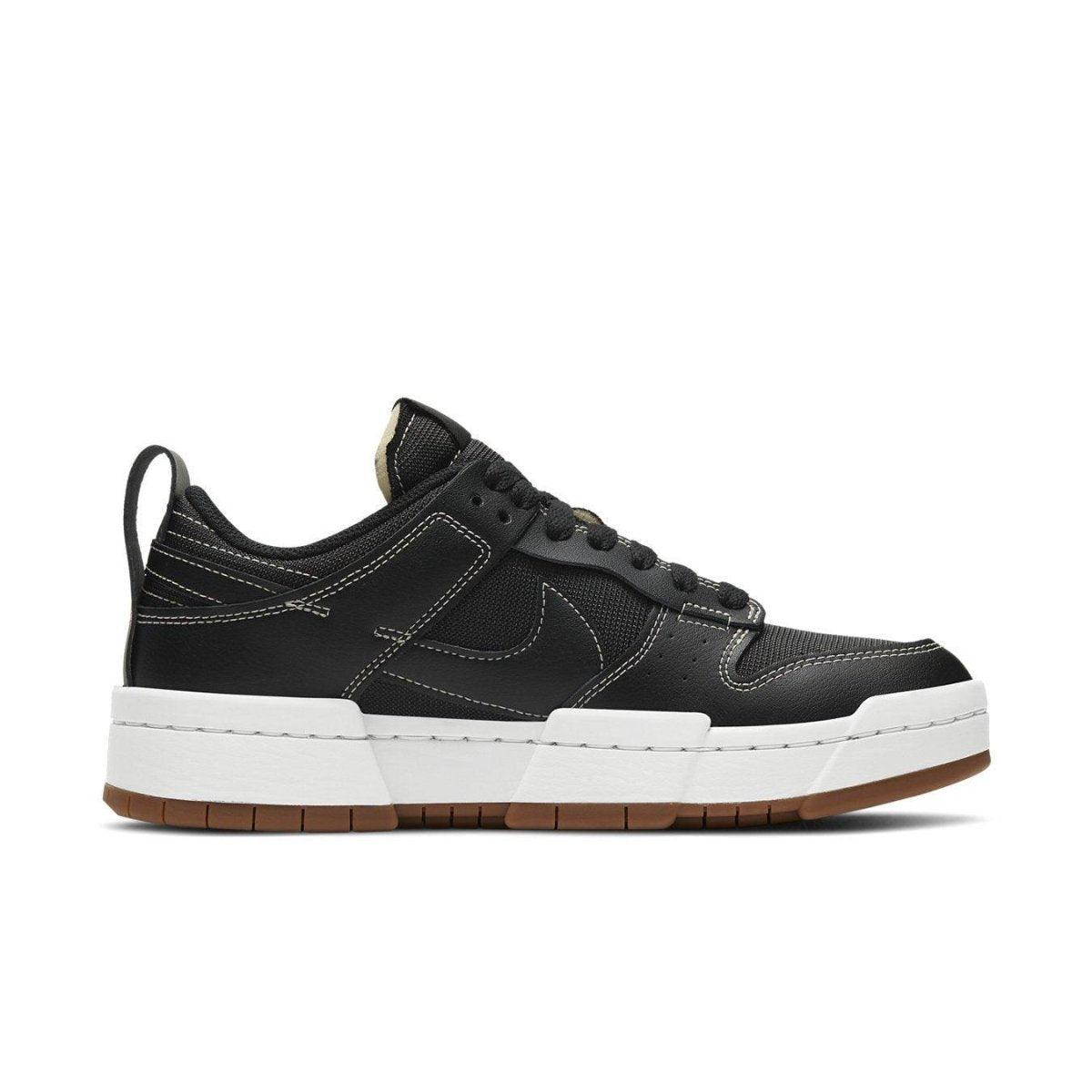 Nike Dunk Low Disrupt Black Gum women's sneaker featuring a platform sole and modern design.
