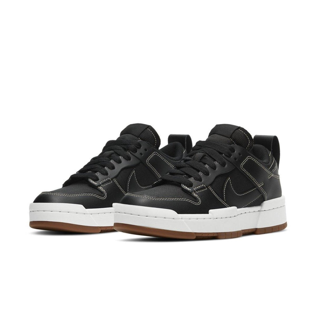 Nike Dunk Low Disrupt Black Gum women's sneakers featuring a modern design and exaggerated silhouette.