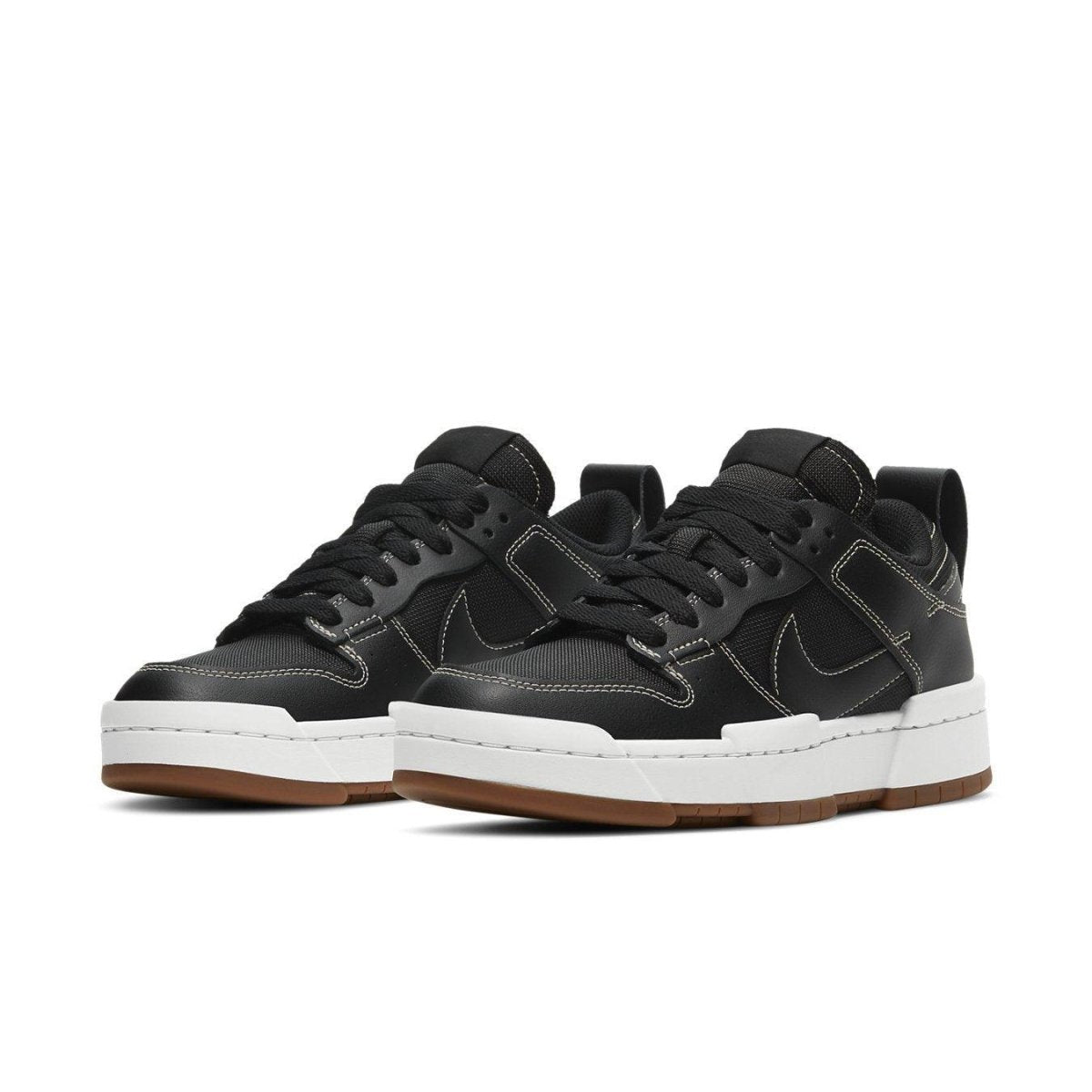 Nike Dunk Low Disrupt Black Gum women's sneakers featuring a modern design and exaggerated silhouette.