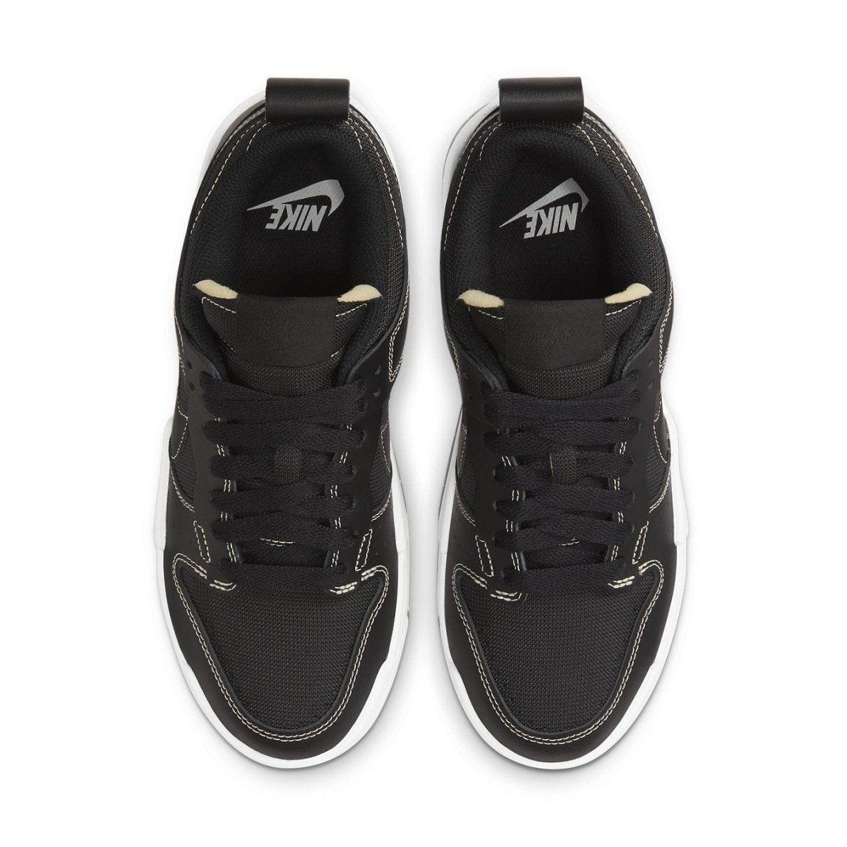 Nike Dunk Low Disrupt Black Gum (W) top view with black upper and white sole design.