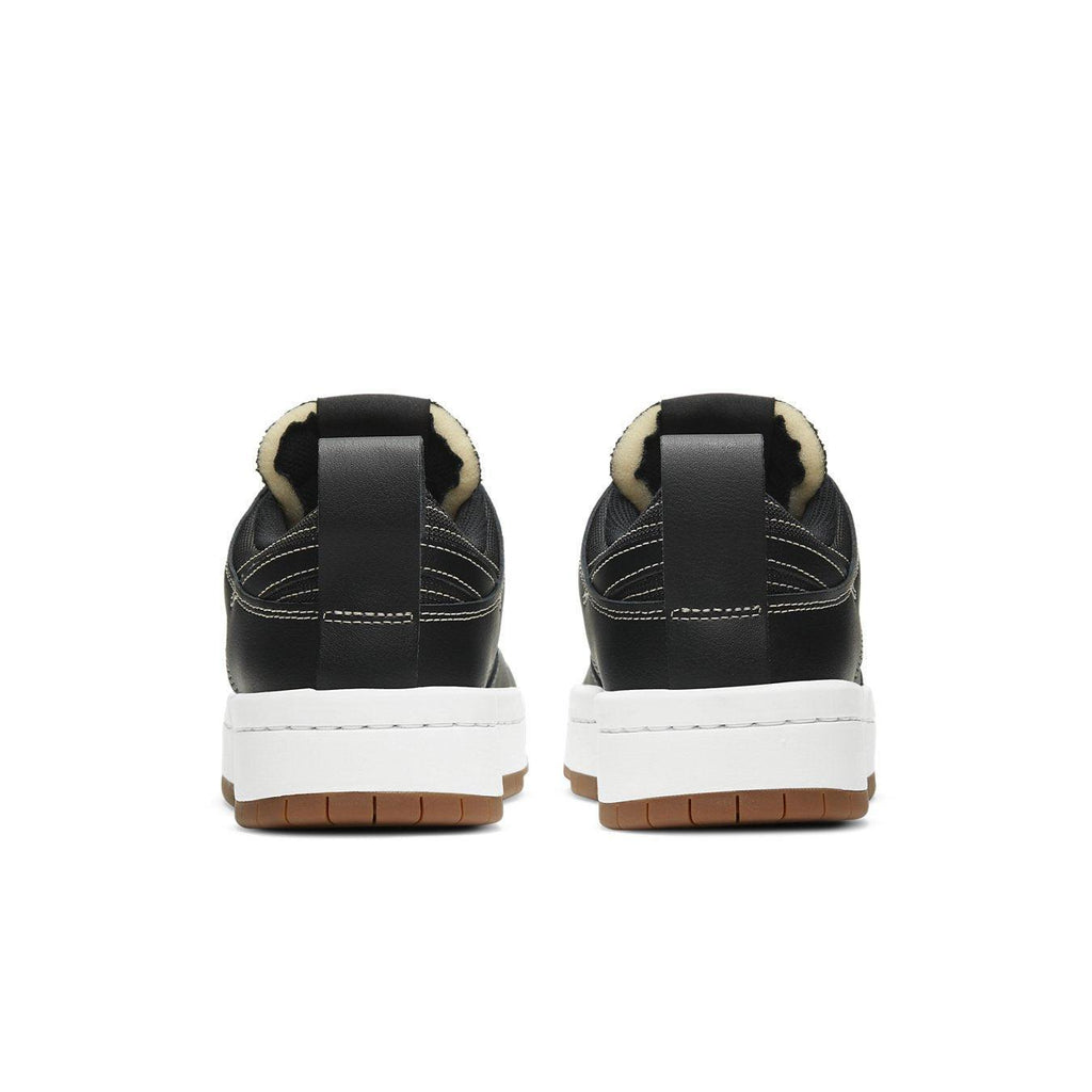 Back view of Nike Dunk Low Disrupt Black Gum (W) showcasing sleek design and platform sole.