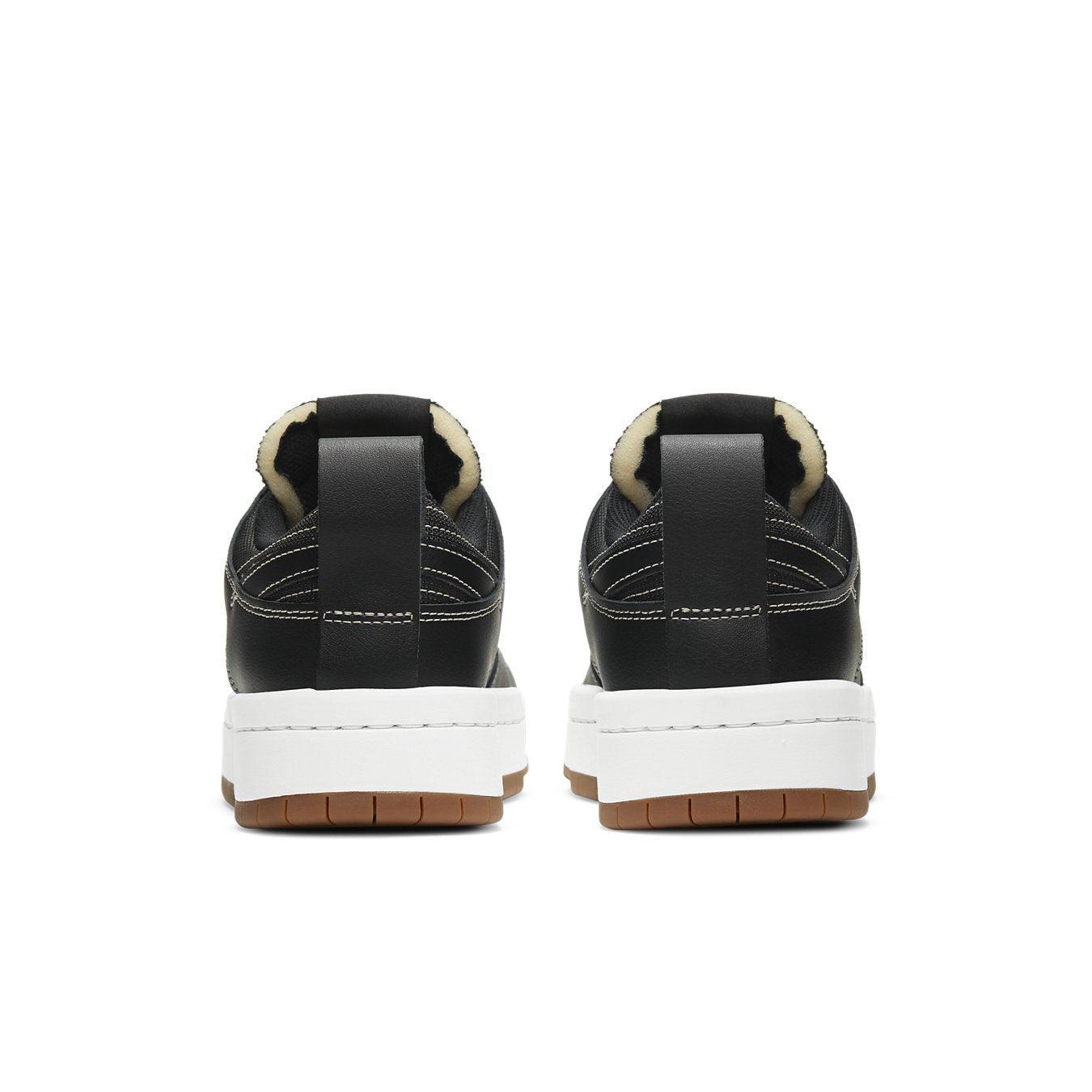 Back view of Nike Dunk Low Disrupt Black Gum (W) showcasing sleek design and platform sole.