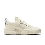 Nike Dunk Low Disrupt Coconut Milk Women's sneakers featuring cream leather panels and padded mesh for a stylish look.
