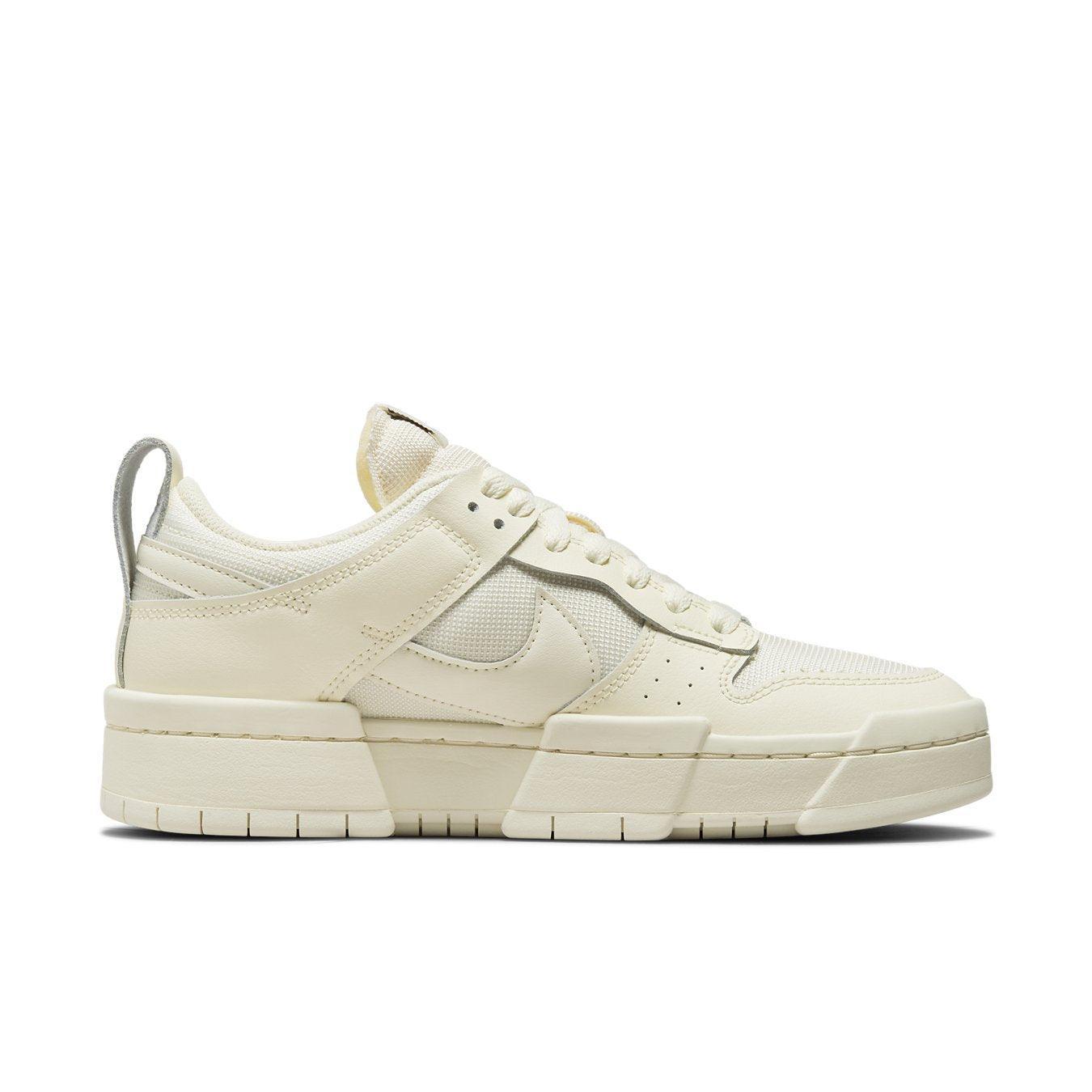 Nike Dunk Low Disrupt Coconut Milk Women's sneakers featuring cream leather panels and padded mesh for a stylish look.