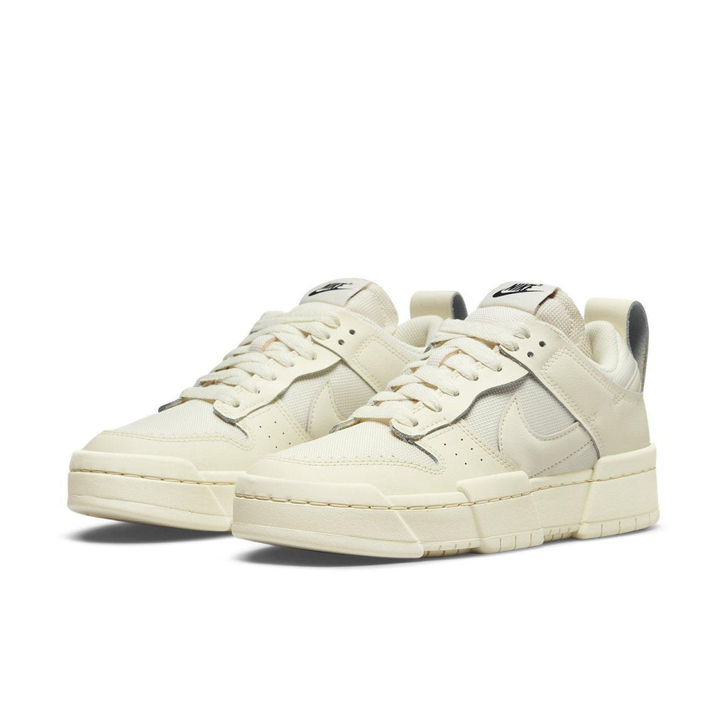 Nike Dunk Low Disrupt Coconut Milk sneakers for women with leather and padded mesh design, offering style and comfort.