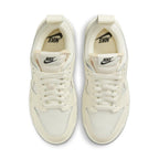 Top view of Nike Dunk Low Disrupt Coconut Milk women's sneakers with cream and white design.