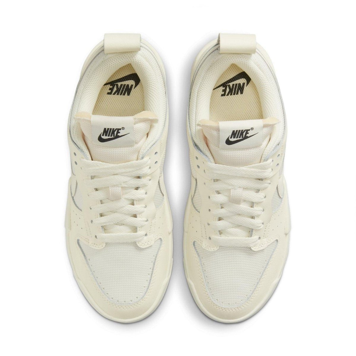 Top view of Nike Dunk Low Disrupt Coconut Milk women's sneakers with cream and white design.