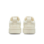 Nike Dunk Low Disrupt Coconut Milk (W) women's sneakers, featuring a thick sole and stylish back view.