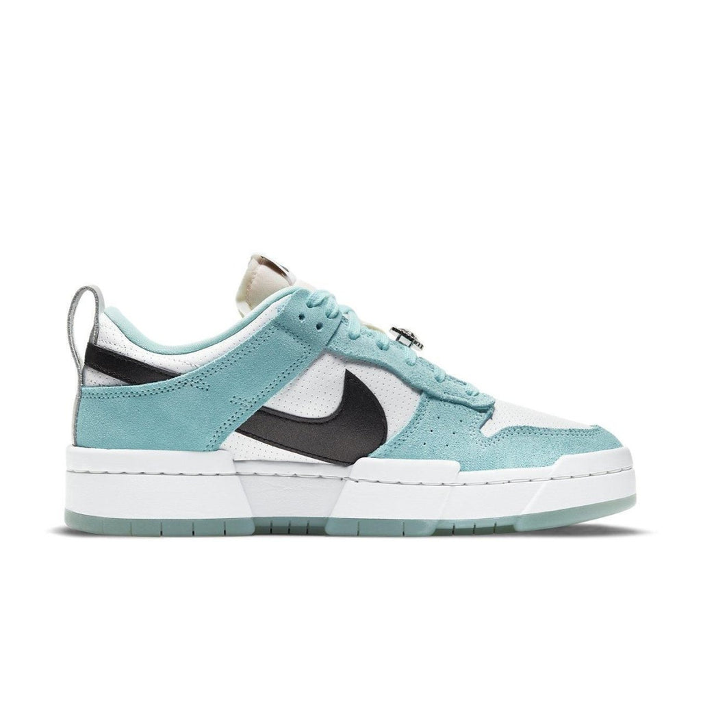 Nike Dunk Low Disrupt Copa sneakers in teal, black, and white with a clean design and transparent sole.