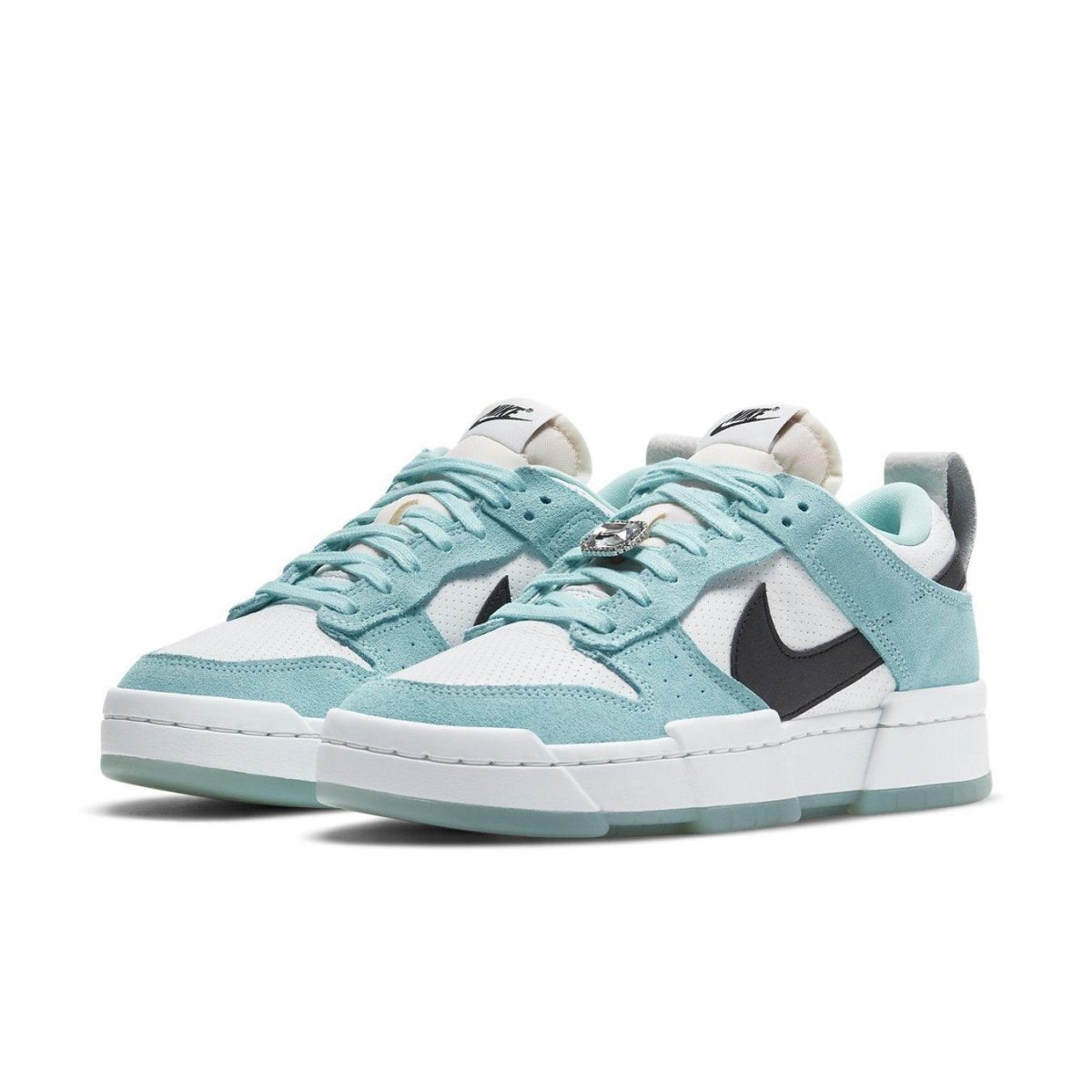 Nike Dunk Low Disrupt sneakers in light blue and black with white sole and signature swoosh, stylish and modern design.
